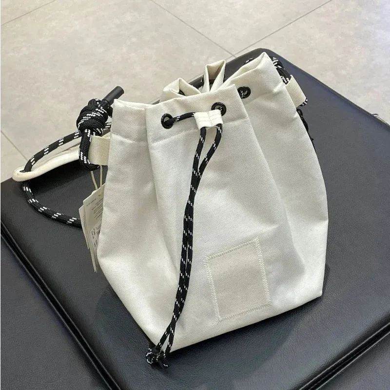 UAKISS  -  2024 Portable Simple Drawstring Handbags Japanese Trendy Women's Crossbody Canvas Bag Casual Travel Mini  Bags Y2k Aesthetic